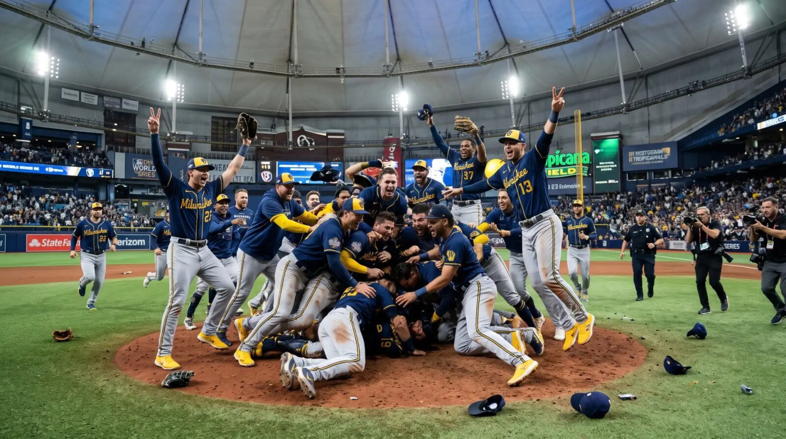 Milwaukee Brewers players celebrate on the infield at Tropicana Field after winning Game 5 of the 2026 World Series.