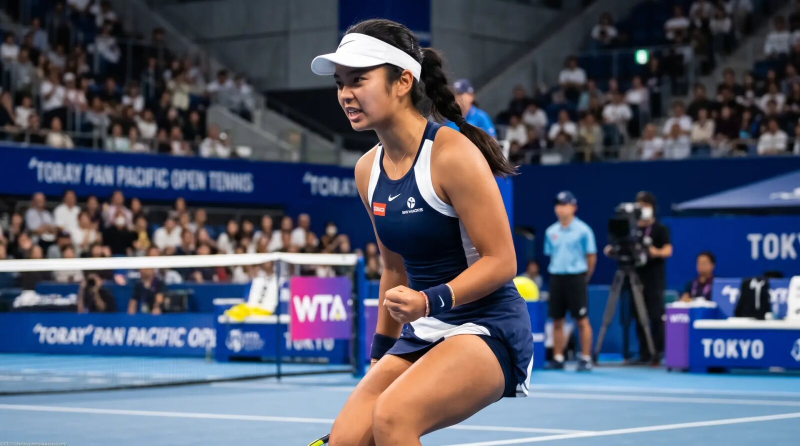 Alexandra Eala pumps her fist after winning a point against Talia Gibson at Ariake Coliseum in Tokyo.